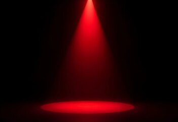 A single red spotlight shining down onto a black stage, with the focus on a black object in the center. The light creates a dramatic spotlight effect, enhancing the object's features create with ai