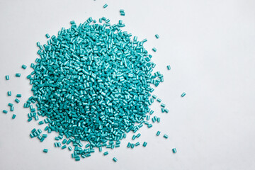 pearl turquoise masterbatch granules on a white background, this polymer is a product coloring...