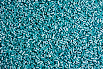 pearl turquoise masterbatch granules on a white background, this polymer is a product coloring...