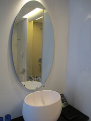 A hotel room interior with a minimalist design that offers comfort and tranquility, making it an ideal destination for a family vacation