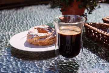 Black coffee in a glass cup.