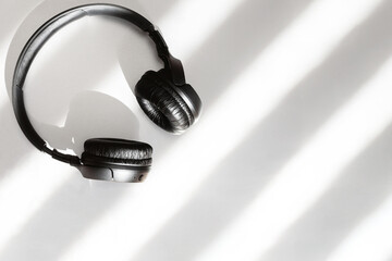 Black modern comfortable wireless headphones, copy space.