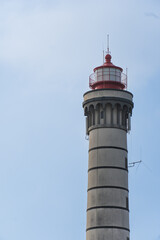 View of lighthouse, typical Portuguese architecture, with nice details and very particular framing, blue sky as background, located in Leça da Palmeira, Porto, Portugal. Matosinhos. Leça Beach