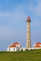 View of lighthouse, typical Portuguese architecture, with nice details and very particular framing, blue sky as background, located in Leça da Palmeira, Porto, Portugal. Matosinhos. Leça Beach