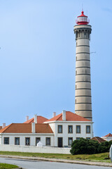 Obraz premium View of lighthouse, typical Portuguese architecture, with nice details and very particular framing, blue sky as background, located in Leça da Palmeira, Porto, Portugal. Matosinhos. Leça Beach