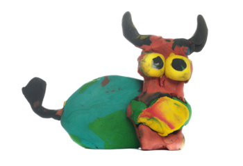 Colorful plasticine in shape cow, modeling clay isolated on white, clipping