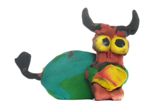 Colorful plasticine in shape cow, modeling clay isolated on white, clipping