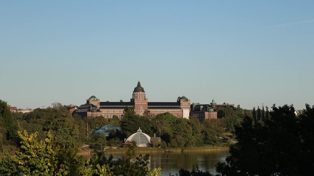 Landscape video at Brunnsviken lake. Museum of natural history or naturhistoriska riksmuseet in the background. Solna, Stockholm, Sweden.