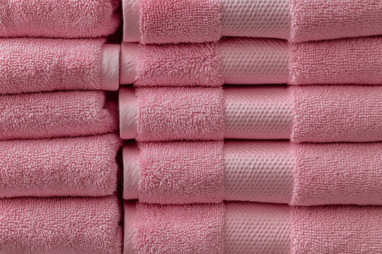 Stacked Pink Hotel Towels, Freshly Folded Linens in Neat Rows, Hotel Amenities Concept