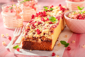 Tasty red currant yeast cake with glaze and crumble.