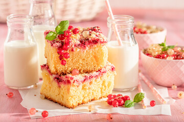 Sweet red currant yeast cake with crumble and glaze.