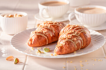Sweet and aromatic pistachio croissants as french snack.