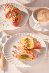 Traditionally and sweet pistachio croissants as french snack.