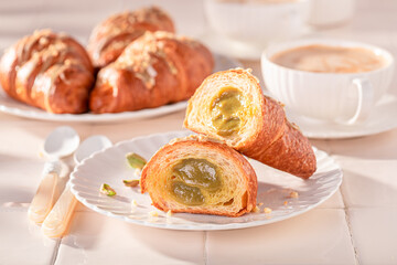 Homemade and hot pistachio croissants as french snack.