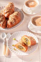 Traditionally and sweet pistachio croissants with nut filling.