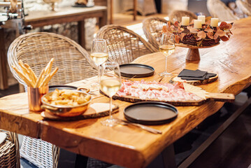 Elegant aperitivo around a huge charcuterie platter.