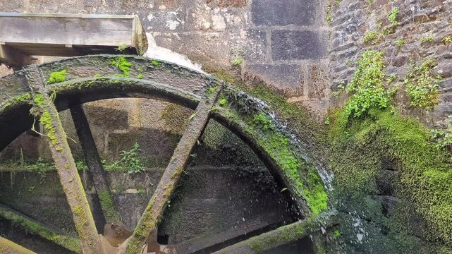 Wheels of a watermill in action (Fougeres, ille-et-Vilaine, Bretagne, France)

