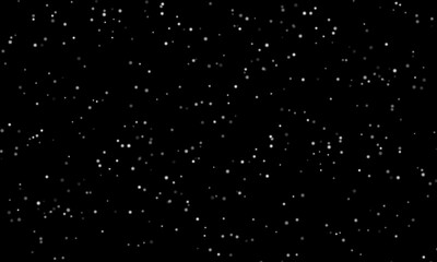 glowing white dust sparkle on black background.