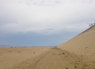 beach on the ocean under a sand dune