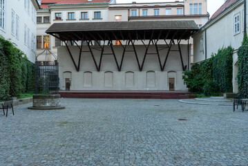 The Liechtenstein Palace is a classicist building. The palace is protected as a cultural monument. The mass of the palace occupies the entire western front of the square.