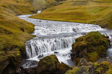 Scogafoss Iceland mountains with river and cascade waterfalls