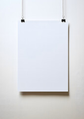 Blank Poster Hanging with Binder Clips on White Wall - Minimalist Design