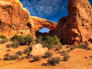 Hiking the Windows Arches Trail in Arches National Park in Utah.