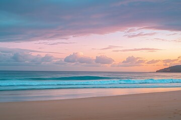 Fototapeta premium Serene beach at sunset with pastel clouds and gentle waves on golden sand, capturing tranquil atmosphere in high-resolution detail.