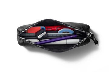 Top view opened pencil case containing various pens, markers, pencils, ruler and erasers isolated...