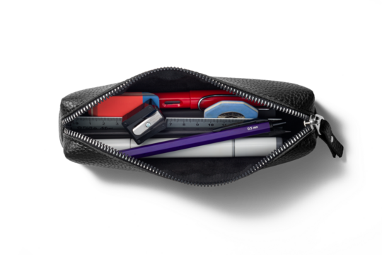 Top view opened pencil case containing various pens, markers, pencils, ruler and erasers isolated on a transparent background, PNG. High resolution.