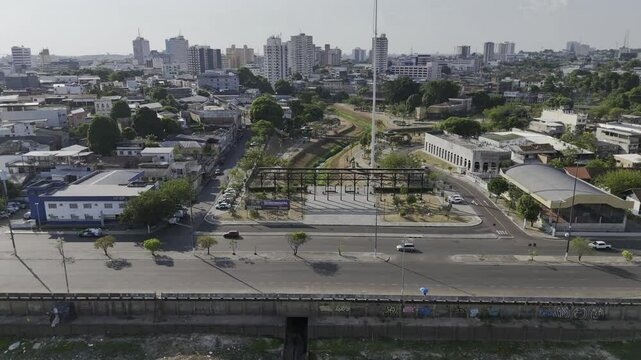 Drone flies over southern entrance to Parque Senador Jefferson Peres in Manaus, Amazonas, Brazil