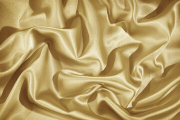 Dusty gold color abstract background. Light pastel soft pale yellow silk satin fabric. Golden luxury elegant beauty premium rich. Shiny glitter shimmer. Drapery. Christmas birthday. Design.