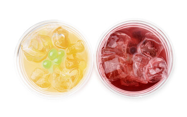 Tasty bubble tea in plastic cups isolated on white, top view