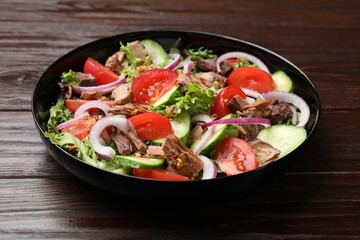 Delicious fresh tuna salad on wooden table, closeup