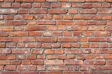 Obraz premium Red brick wall background with visible textures and patterns, perfect for creative projects or adding a nostalgic and timeless touch to any space.