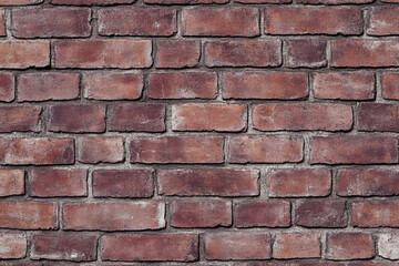 Obraz premium Red brick wall background with visible textures and patterns, perfect for creative projects or adding a nostalgic and timeless touch to any space.
