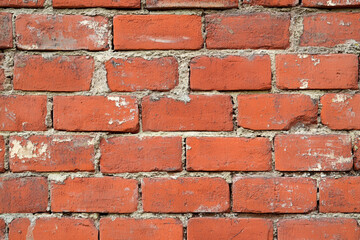 Obraz premium Red brick wall background with visible textures and patterns, perfect for creative projects or adding a nostalgic and timeless touch to any space.