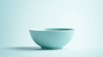 A simple, light blue bowl on a soft background, emphasizing minimalism and design.