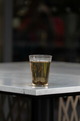 Vertical Shot of Hot Tea on White Table: Warm and Soothing Beverage for Relaxation