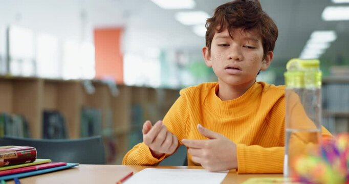 Boy, homework and counting for math at library in school with notebook for writing notes. Kid, education and thinking with stationery for project with numbers for child growth and brain development