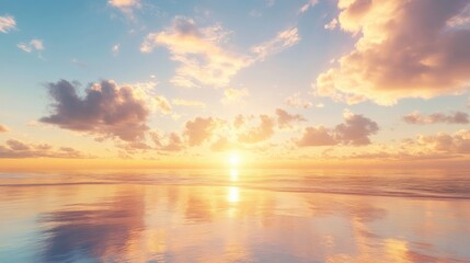 Obraz premium Golden sky at sunrise with soft clouds and reflections on the ocean, creating a serene and picturesque scene