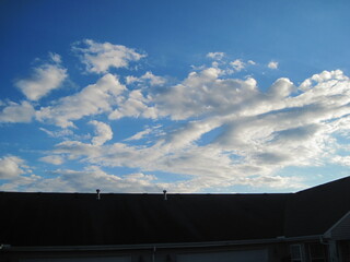 Fototapeta premium sky and clouds over building roof