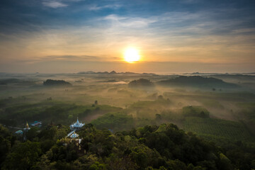 Landscape of beautiful morning fog sunrise at Khao Na Nai Luang Dharma Park in Surat Thani province, Thailand