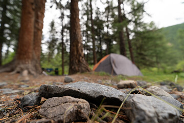 empty stone surface on the background of camping in the forest