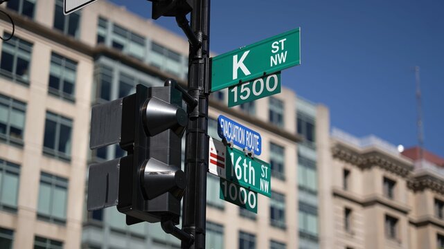 K street nw and 16th street nw street signs in downtown Washington DC symbolizing lobbying and corruption in nations capital