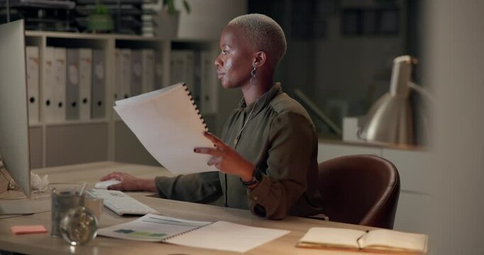 Accountant, documents and black woman with computer, typing and search for numbers, internet and research. African person, evening and employee with paperwork, feedback and review income in office