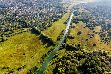 Quadcopter view of a picturesque rural landscape with a small river Luzha. Maloyaroslavetsky...