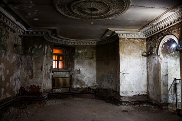 Gloomy shabby underground floor of an old mansion illuminated by weak light