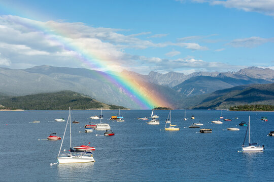 Lake Granby, Colorado with boats and a rainbow on a sunny day