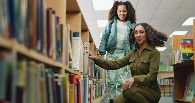 Library, choice and kid with book for learning, education and reading at school with teacher helping. Girl child, bookshelf or woman giving textbook for happy student with librarian for fantasy story